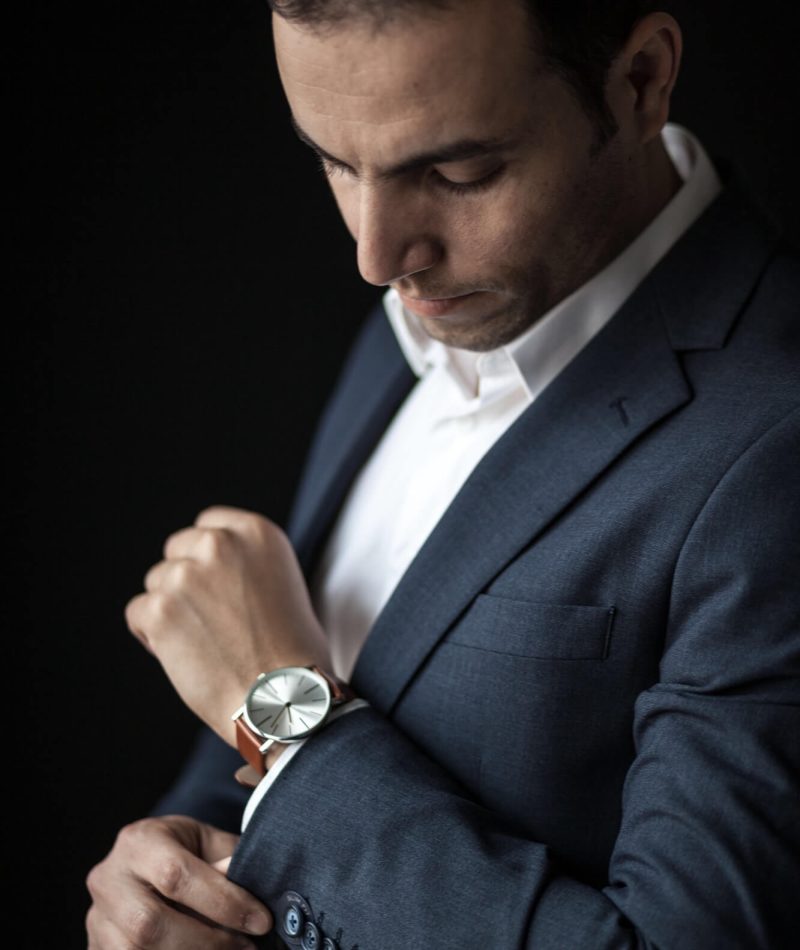 man-adjusting-his-sleeves-wearing-a-watch-1.jpg man-adjusting-his-sleeves-wearing-a-watch-1.jpg
